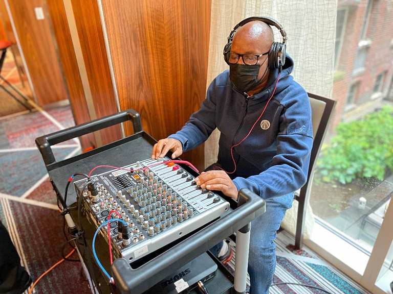 Audio Engineer Quentin Addison makes sure that the sound will be heard online and in person.