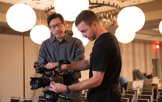 Director Ben Wong supervises a dolly shot with the Sony FS7 MarkII camera, Video Production MTITV