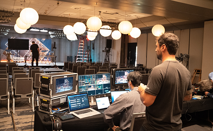 Technical Director Ben Wong at the controls, managing the many feeds needed for a successful webinar, Video Production MTITV