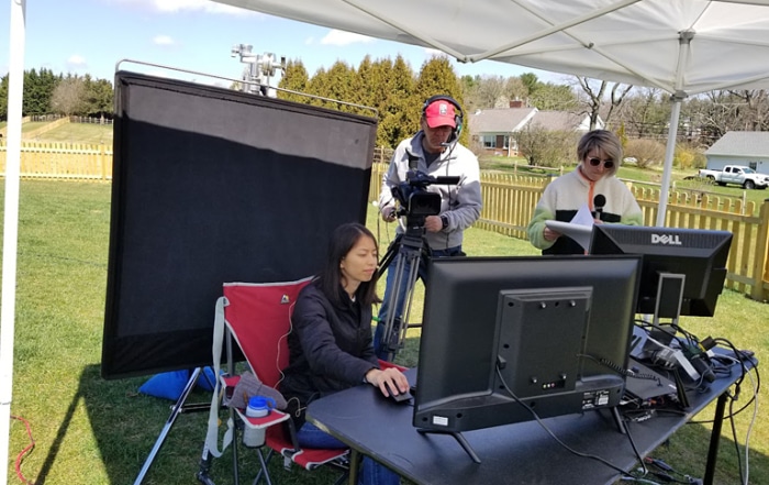 MTI Cameraman Sean Chadwick focuses on the computer screen showing Rebekah Yang's coding action while Caitlin Windland narrates.