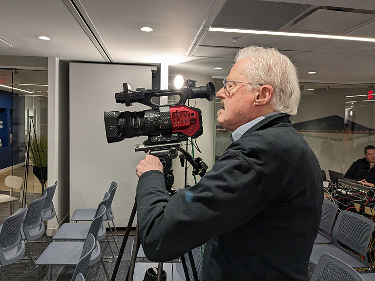 Camera Operator John Murphy makes sure that the Panasonic AGDVX 200 is set up to capture the event