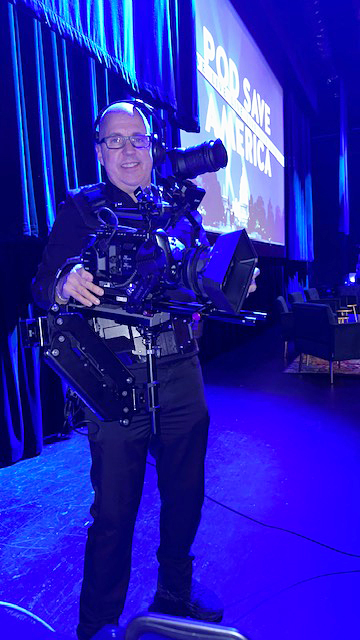 Cameraman Todd Burger strapped into his mobile camera gear, ready to roam the theater for the best shot.