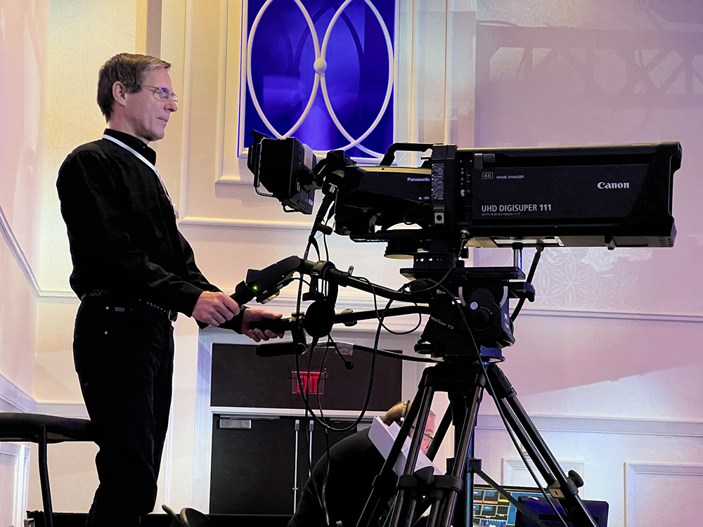 Albert Liesegang handles the large front-of-house video camera for the CVS live event.