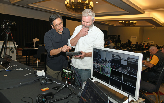 Ben Wong (l) and John Bogley (r) confer on the right technical specs for the video shoot. Photo by Leigh Mosely.